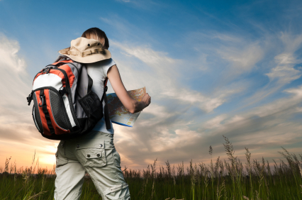 young woman with map and backpack